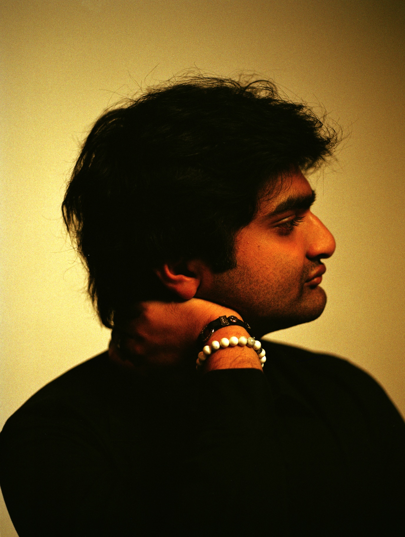 Eshan Agarwal in profile, hand at chin
