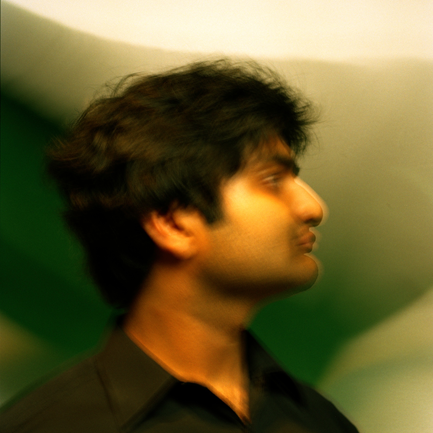 Eshan Agarwal profile portrait, green backdrop